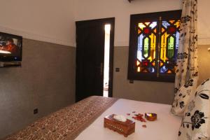 Postelja oz. postelje v sobi nastanitve Riad Nesma Suites & Spa