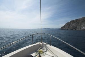 a boat in a body of water at Hostal Juventus in Portbou