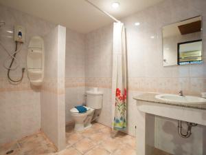 a bathroom with a toilet and a sink and a shower at Stefan's Guesthouse in Jomtien Beach +88 photos