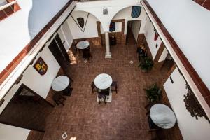 an overhead view of a lobby with tables and chairs at Hotel Carlos V Jerez by Vivere Stays in Jerez de la Frontera