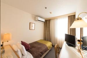 Katil atau katil-katil dalam bilik di Sky Hotel Uozu