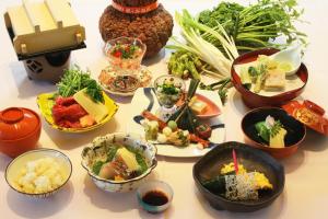 a group of bowls of food on a table at Chion-in Wajun Kaikan in Kyoto