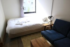 Postel nebo postele na pokoji v ubytování Wise Owl Hostels Shibuya