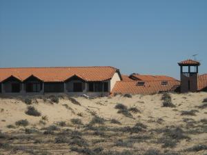 a house on the beach with a tower on it at Appartement Santocha in Capbreton