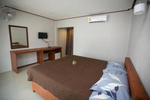 Postel nebo postele na pokoji v ubytování Lamai Resort