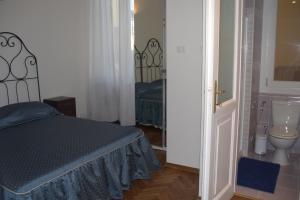 Postel nebo postele na pokoji v ubytování B&B Ai Confini dell'Impero