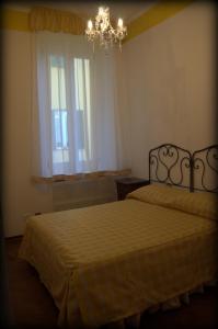 Postel nebo postele na pokoji v ubytování B&B Ai Confini dell'Impero