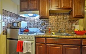 a kitchen with a sink and a stove top oven at Two Bedroom Apartment - North East Bronx in Bronx