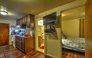 a small kitchen with a bed and a small room with a kitchen at Two Bedroom Apartment - North East Bronx in Bronx