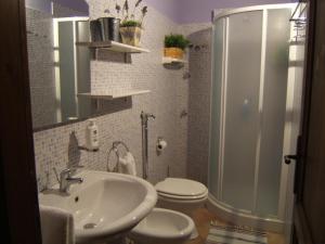 a bathroom with a shower and a sink and a toilet at B&B Del Corso in Mazara del Vallo
