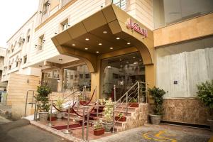 a store front of a building with stairs in front at قصر البسمة للشقق المخدومةSMILE Serviced Apartments in Jeddah