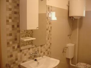 a small bathroom with a sink and a toilet at Dominik in Orebić +94 photos