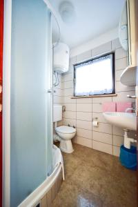 Koupelna v ubytování Room Marijana
