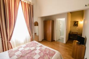 Postel nebo postele na pokoji v ubytování Hotel Iris
