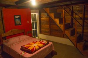 a bedroom with a bed and a staircase at Cabañas Cinco Lagos in Santiago