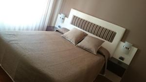Posteľ alebo postele v izbe v ubytovaní Hotel El Millón