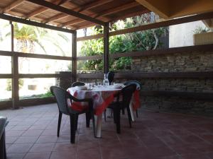 a table and chairs sitting on a patio at Mare Blu in Stintino