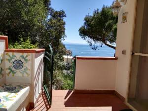 a balcony with a view of the ocean at Casa Vacanze Bouganvillea in Cetara