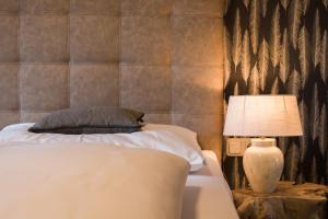 Postel nebo postele na pokoji v ubytování Gasthof Hotel Hauslwirt