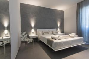 Posteľ alebo postele v izbe v ubytovaní Le Ancore Luxury Apartments