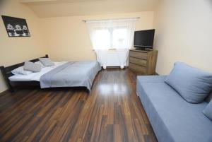 Posteľ alebo postele v izbe v ubytovaní Mazuria Apartamenty
