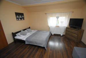 Posteľ alebo postele v izbe v ubytovaní Mazuria Apartamenty