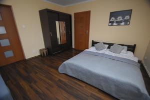 Posteľ alebo postele v izbe v ubytovaní Mazuria Apartamenty