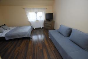 Posteľ alebo postele v izbe v ubytovaní Mazuria Apartamenty