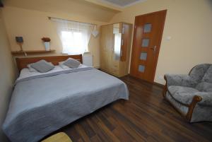 Posteľ alebo postele v izbe v ubytovaní Mazuria Apartamenty