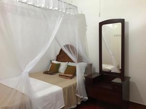 Katil atau katil-katil dalam bilik di Wilpattu Dolosmahe