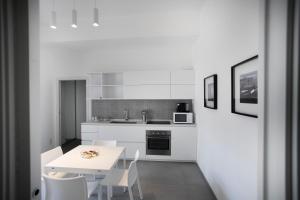 Kuchyň nebo kuchyňský kout v ubytování Le Ancore Luxury Apartments + 37 fotografií