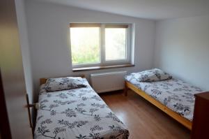 Säng eller sängar i ett rum på Agroturystyka Sominy Piotr