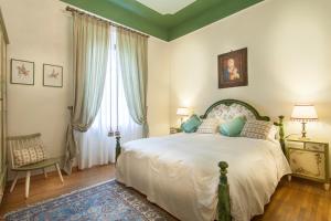 Postel nebo postele na pokoji v ubytování Villa Gobbi Benelli + 37 fotografií