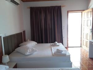 Voodi või voodid majutusasutuse Hotel Riviera toas