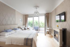 Rúm í herbergi á Sofie Apartments
