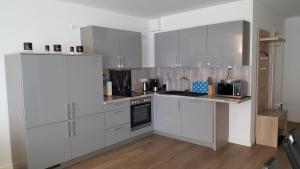 Kuchyň nebo kuchyňský kout v ubytování Ferienwohnung Dünenperle + 21 fotografií