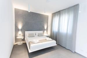 Posteľ alebo postele v izbe v ubytovaní Le Ancore Luxury Apartments