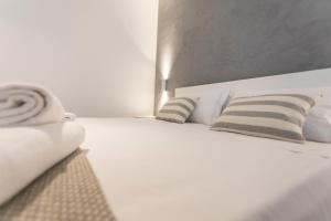 Posteľ alebo postele v izbe v ubytovaní Le Ancore Luxury Apartments