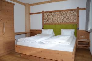 Postel nebo postele na pokoji v ubytování Bergsonne