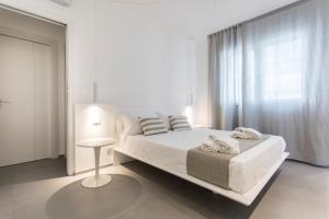 Posteľ alebo postele v izbe v ubytovaní Le Ancore Luxury Apartments