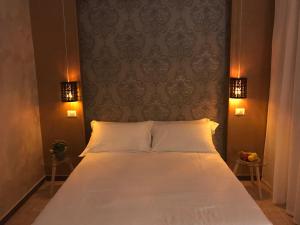 Posteľ alebo postele v izbe v ubytovaní Hotel Raphael