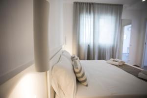 Posteľ alebo postele v izbe v ubytovaní Le Ancore Luxury Apartments