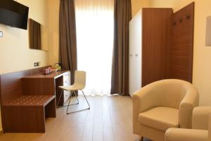 TV a/nebo společenská místnost v ubytování Hotel Residence Eden