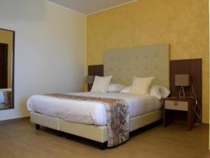Postel nebo postele na pokoji v ubytování Hotel Residence Eden