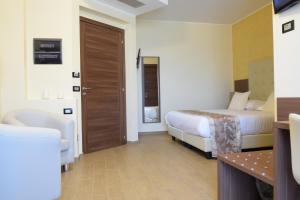 Postel nebo postele na pokoji v ubytování Hotel Residence Eden