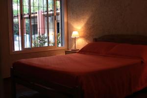 Postel nebo postele na pokoji v ubytování Cabañas Parque Vistalba