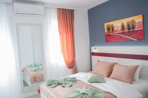 A bed or beds in a room at Apartmani Banja SPA
