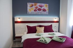 A bed or beds in a room at Apartmani Banja SPA
