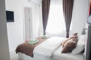 A bed or beds in a room at Apartmani Banja SPA