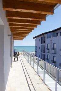 a balcony with a view of the beach at Residence la Perla in Caorle